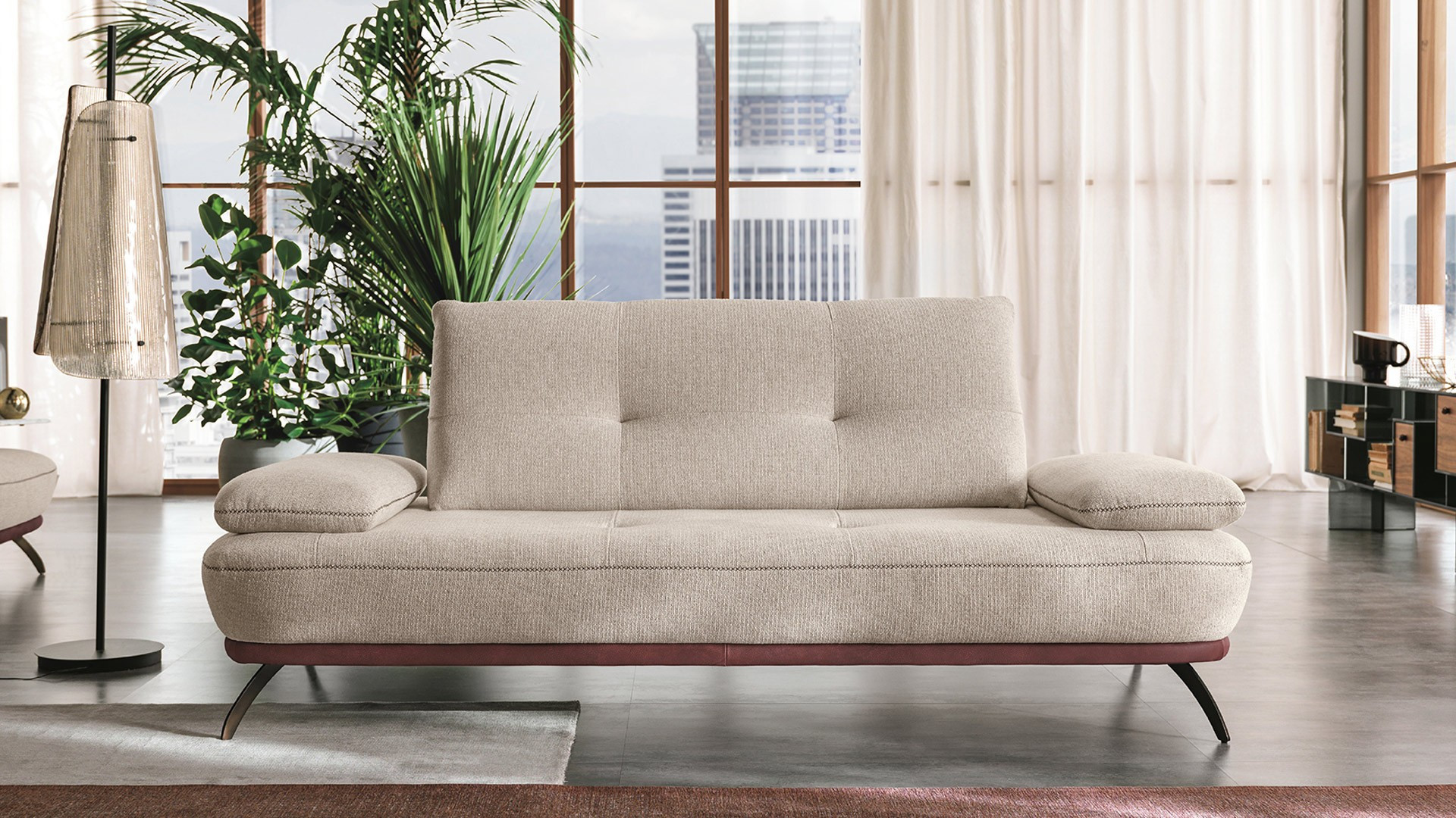 BOGART sofa - Elegant matching stitching on the base accentuates the curves of this designer sofa in leather or fabric.
